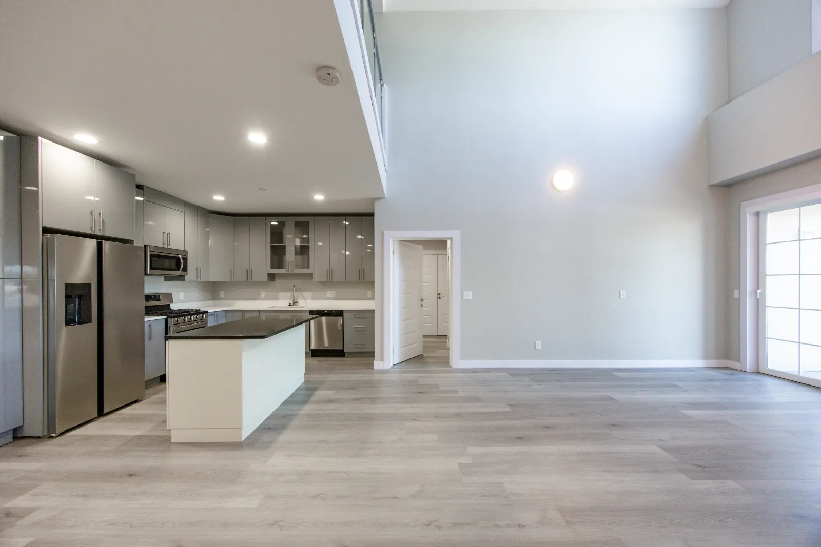 Kitchen with island and living room — Taj Estates of Franklin I