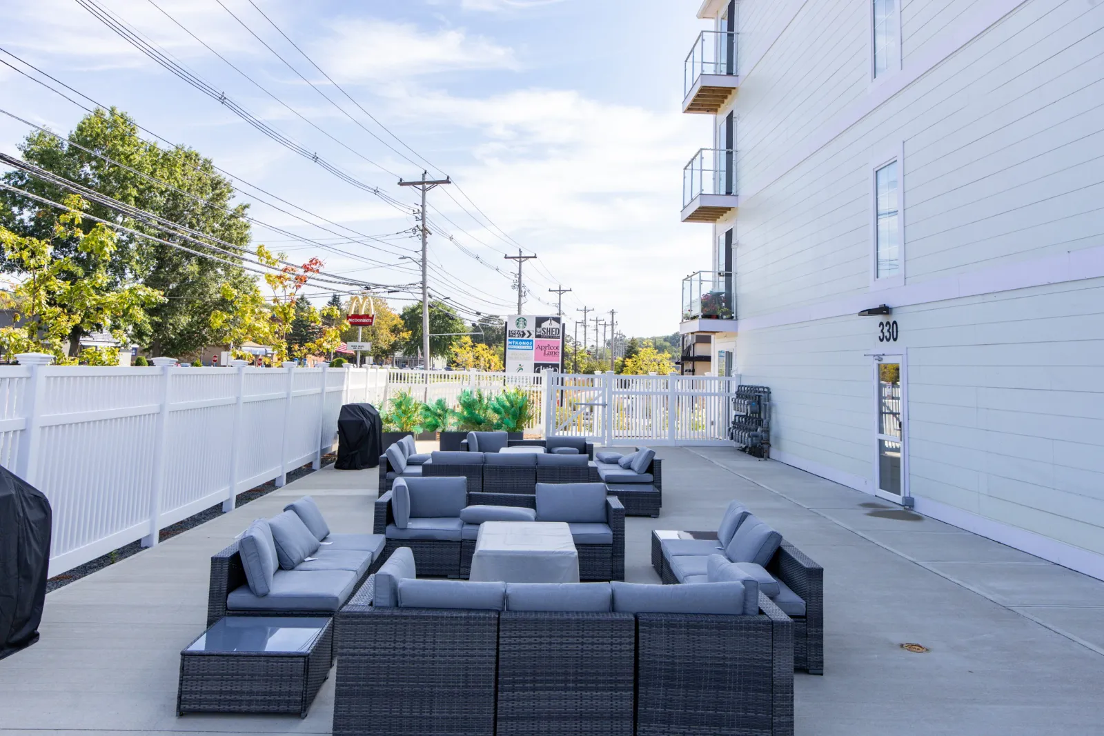 Outdoor lounge and grill area at Taj Estates